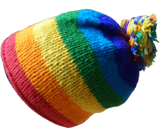 Main image of fleece lined rainbow striped beanie hat finished with a generous pom pom. Hand knitted in Nepal. One size.
