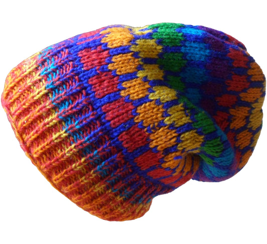 Main image of 1/2 fleece lined rainbow large slouch style beanie. Geometric design to upper part of the hat with ribbed finish to lower hat. Hand knitted in Nepal. One size.