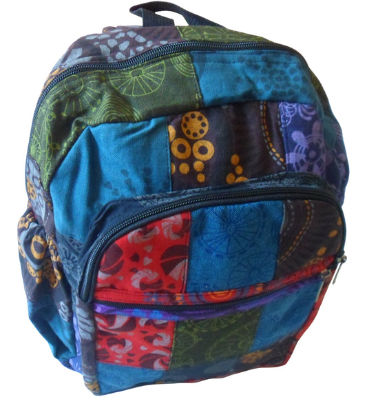 Multi-colour patchwork squares fully lined backpack with zip fastenings. 6 pockets & webbed carry handle.