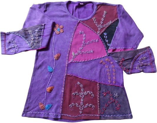 Main Image: Nepalese Cotton Applique Flower Embroidered Top  Benefits & Features: Patchwork sections applied to the front of the top & sleeves with applique leaves & flower embroidery. Plain colour to the back of garment. Stretch cotton for comfort & ease of wear.